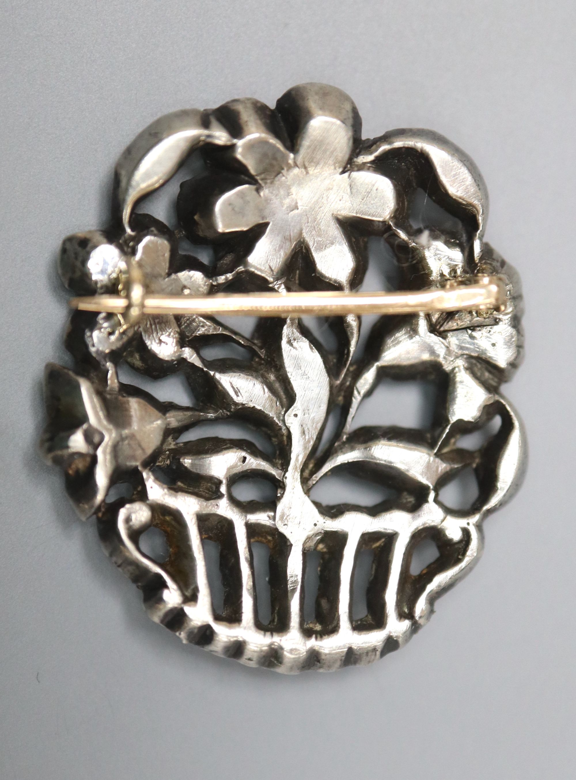 An early-mid 20th century white metal and paste set giardinetto brooch, 33mm, gross 9.4 grams.